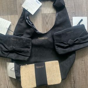 Donna Karan black hobo bag with 3 smaller pouches . New with tags .